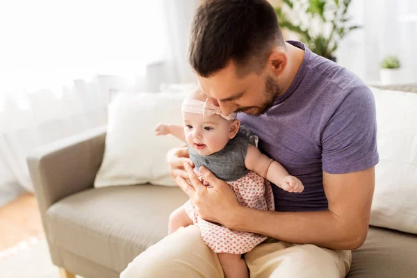 Close up of father with little baby girl at home — Stock Photo, Image