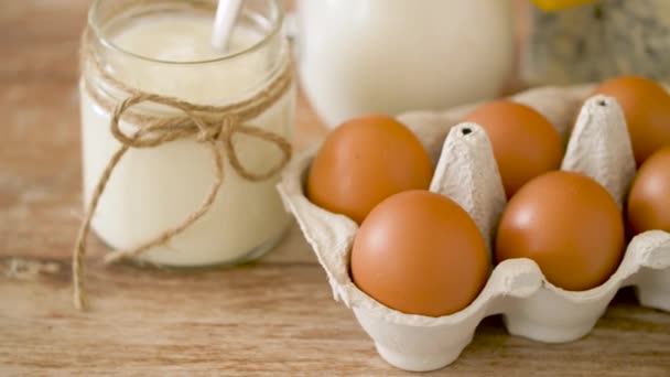 Chicken eggs, milk, sour cream and cottage cheese — Stock Video