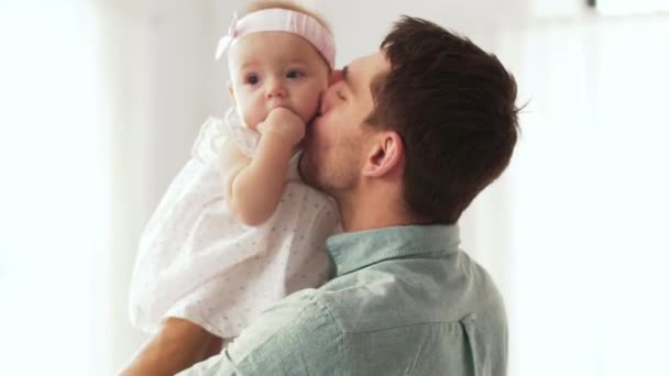 Happy father kissing little baby daughter — Stock Video