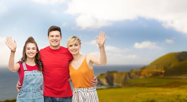 Happy friends hugging over background — Stock Photo, Image