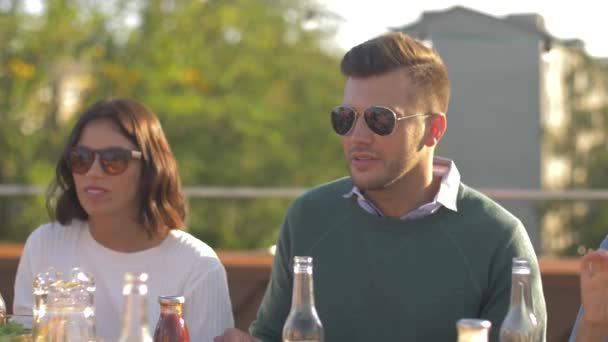 Friends having dinner or bbq party on rooftop — Stock Video