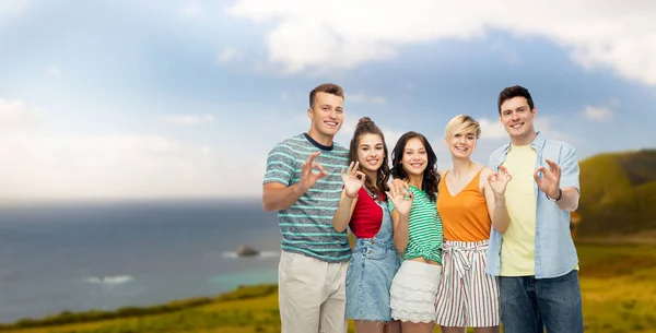 Happy friends showing ok hand sign — Stock Photo, Image