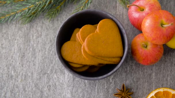 Glass of hot mulled wine, cookies, apples and fir — Stock Video