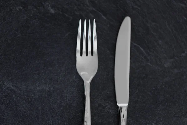 Close up of fork and knife on table — Stock Photo, Image