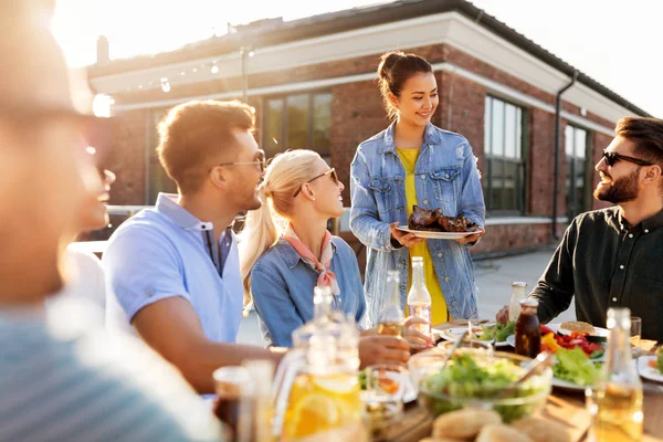 Friends at barbecue party on rooftop in summer — Stock Photo, Image