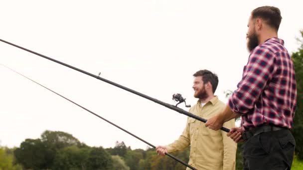 Happy friends with fishing rods — Stock Video