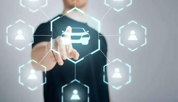 Businessman with virtual hologram of car sharing — Stock Photo, Image