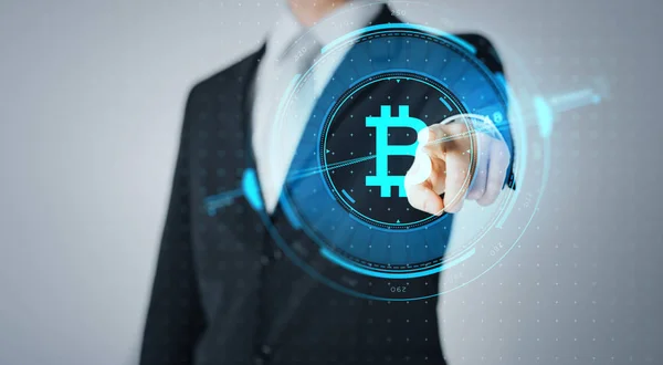 Close up of businessman with bitcoin hologram — Stock Photo, Image