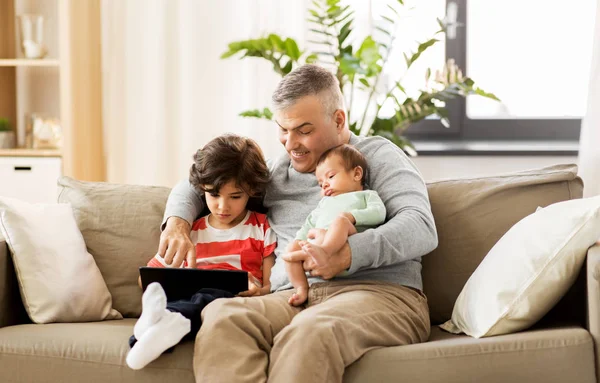 Happy father with preteen and baby son at home — Stock Photo, Image