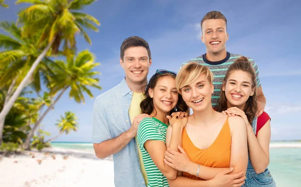 Happy friends over tropical beach background — Stock Photo, Image