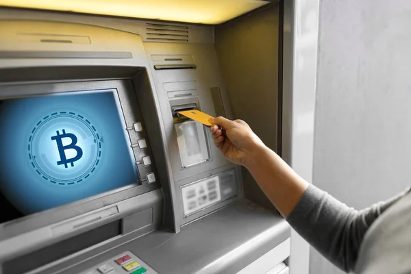 Close up of woman inserting card to atm machine — Stock Photo, Image