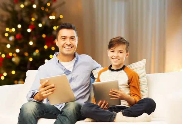 Father and son with tablet computers on christmas — Stock Photo, Image