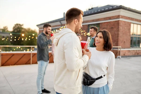 Friends with non alcoholic drinks at rooftop party Royalty Free Stock Images