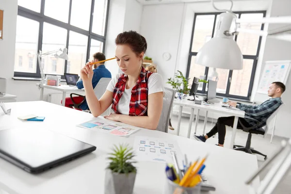 Creative woman working on user interface at office — Stock Photo, Image
