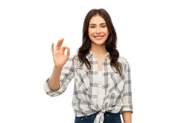 Jonge vrouw of tienermeisje in geruite shirt — Stockfoto