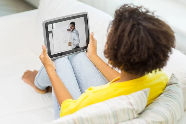 Woman watching webinar on tablet computer at home — Stock Photo, Image