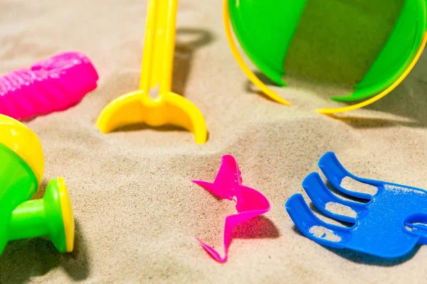 Close up of sand toys kit on summer beach — Stock Photo, Image