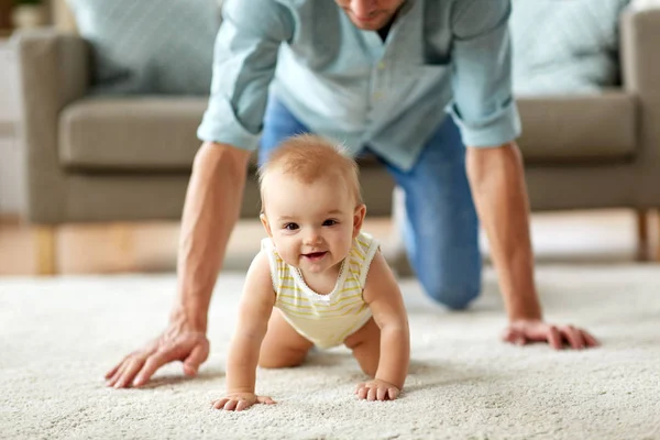 Happy little baby girl with father at home — Stock Photo, Image