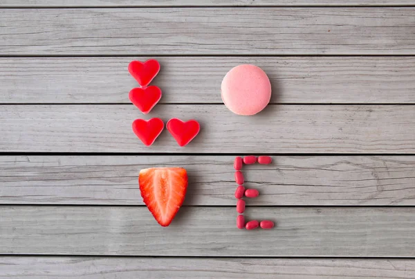 Close up of word love made of sweets — Stock Photo, Image