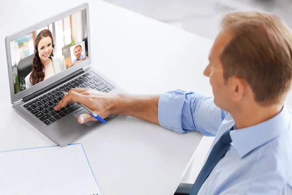 Businessman having video call on laptop at office — Stock Photo, Image