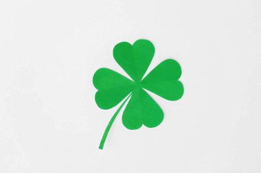 green paper four-leaf clover on white background clipart