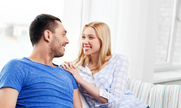 Happy couple with laptop computer at home — Stock Photo, Image