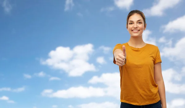 Woman or teenage girl in t-shirt showing thumbs up — Stock Photo, Image