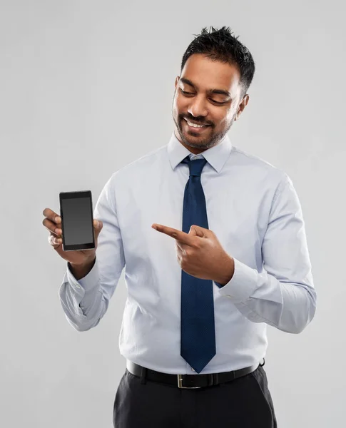 Indian businessman with smartphone — Stock Photo, Image