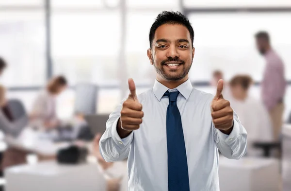 Indian businessman showing thumbs up at office — Stock Photo, Image