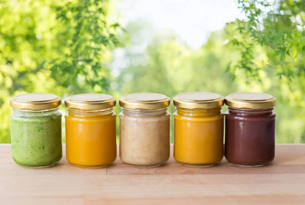 Vegetable or fruit puree or baby food in jars — Stock Photo, Image