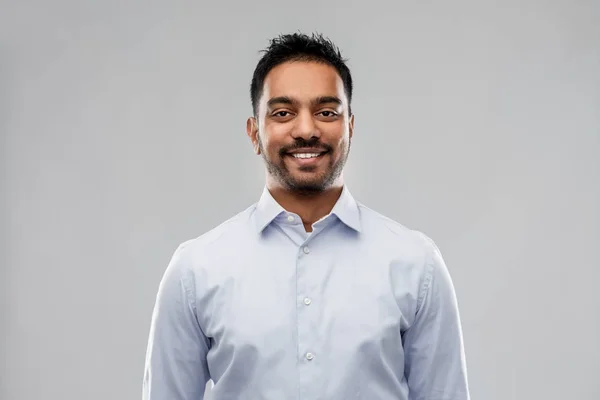 Indian businessman in shirt over grey background — Stock Photo, Image