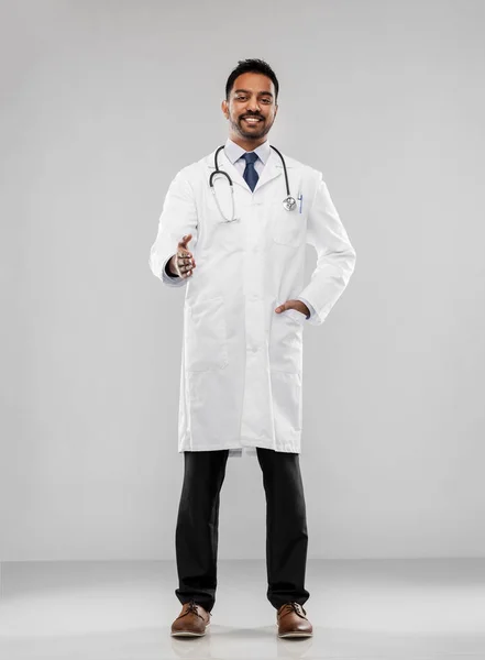 Indian male doctor givin hand for handshake — Stock Photo, Image