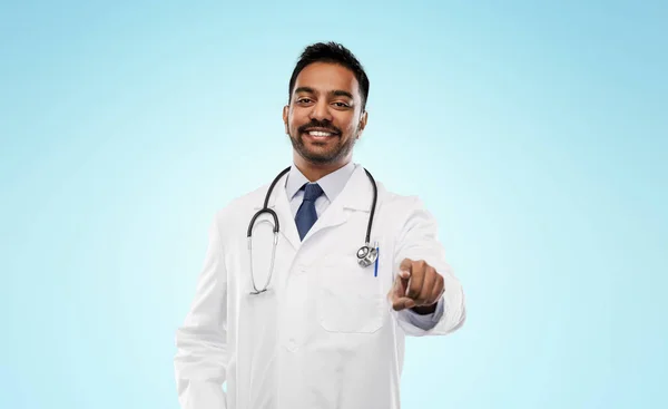 Smiling indian male doctor pointing finger to you — Stock Photo, Image