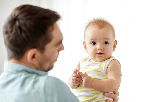 Father with little baby daughter on white — Stock Photo, Image