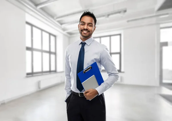 Indian businessman or realtor in empty office room — Stock Photo, Image