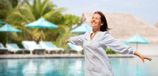 Happy woman over swimming pool of touristic resort — Stock Photo, Image