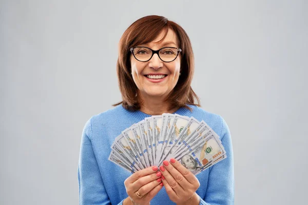 Senior woman with hundred dollar money banknotes — Stock Photo, Image