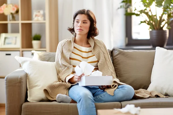 Sick woman taking paper tissue from box at home — Stock Photo, Image