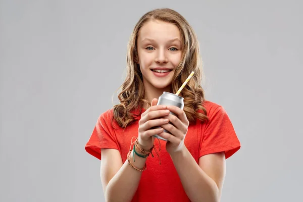 Teenage girl holding can of soda with paper straw — Stock Photo, Image