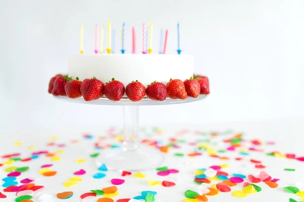 Close up of birthday cake with candles on stand — Stock Photo, Image