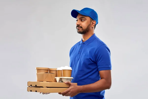 Indian delivery man with food and drinks — Stock Photo, Image