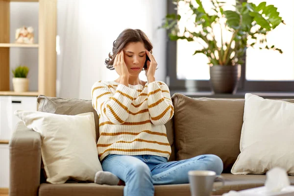 Sad sick woman in scarf at home — Stock Photo, Image