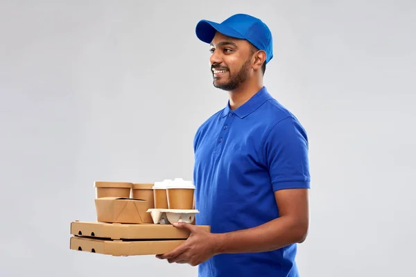 Happy indian delivery man with food and drinks — Stock Photo, Image