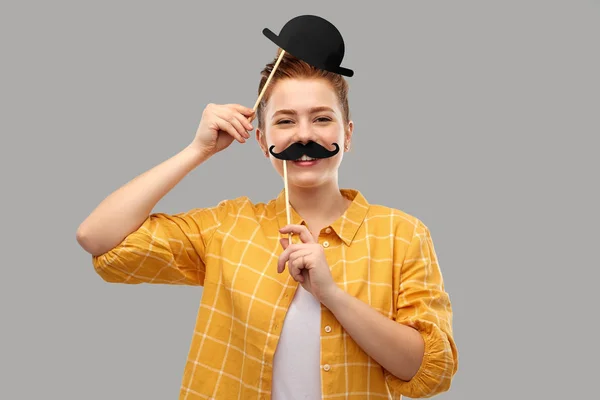 Red haired teenage girl with black moustaches — Stock Photo, Image
