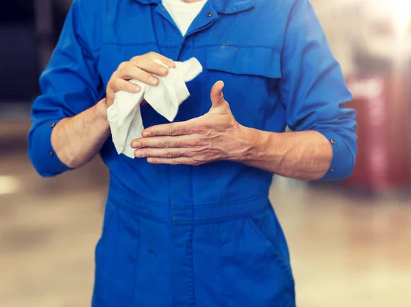 Mechanic man or smith with wipe at car workshop — Stock Photo, Image