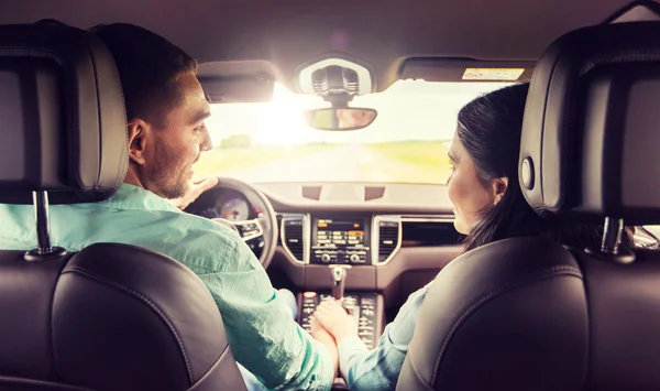 Happy man and woman driving in car — Stock Photo, Image