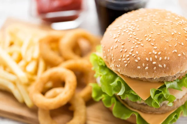 Close up of hamburger and other fast food — Stock Photo, Image