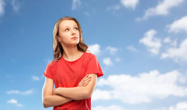 Teenage gir with crossed arms over sky — Stock Photo, Image