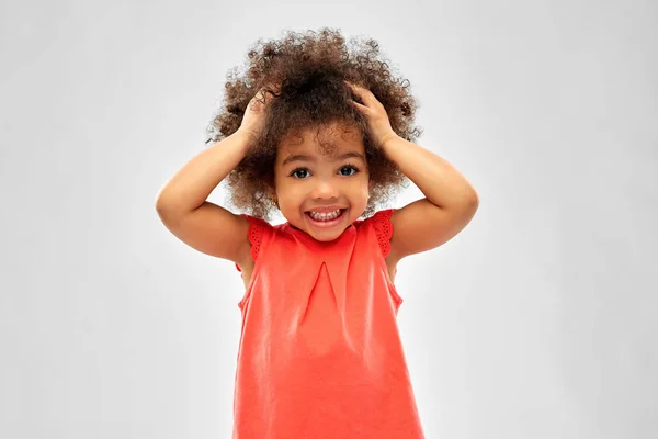 Overwhelmed african american girl holding to head — Stock Photo, Image