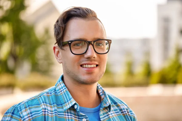 Portrait of man in glasses outdoors in summer Stock Picture